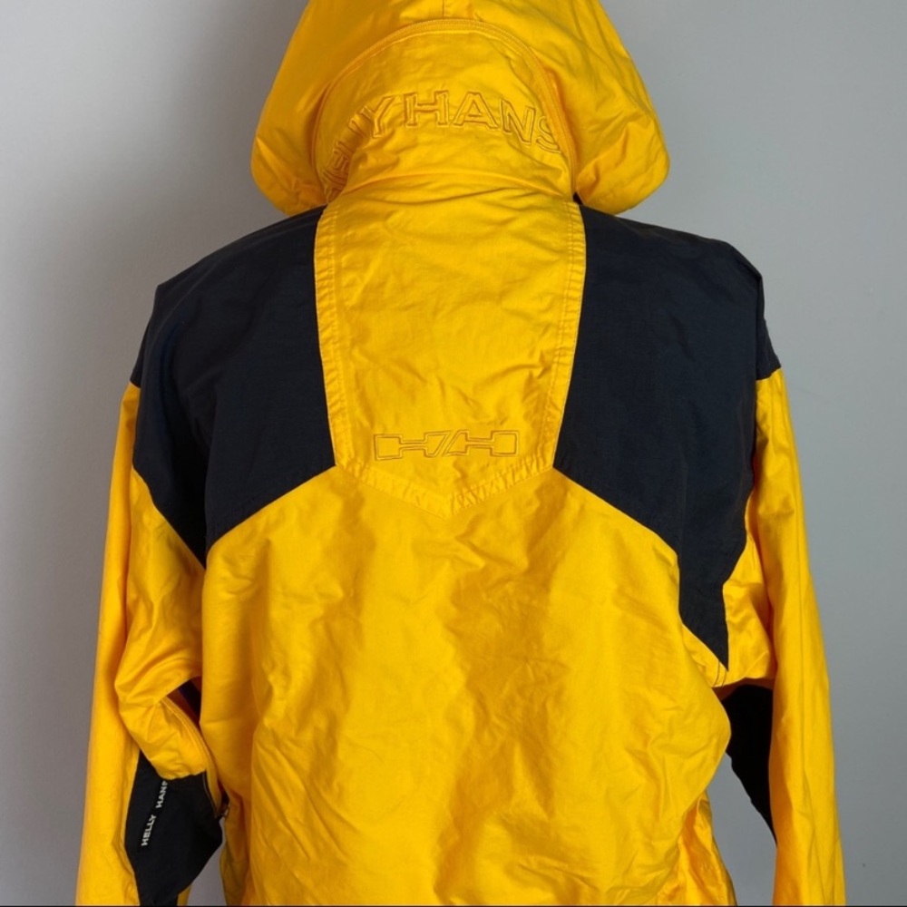 Helly Hanson black yellow rain jacket. Outerwear Windbreaker